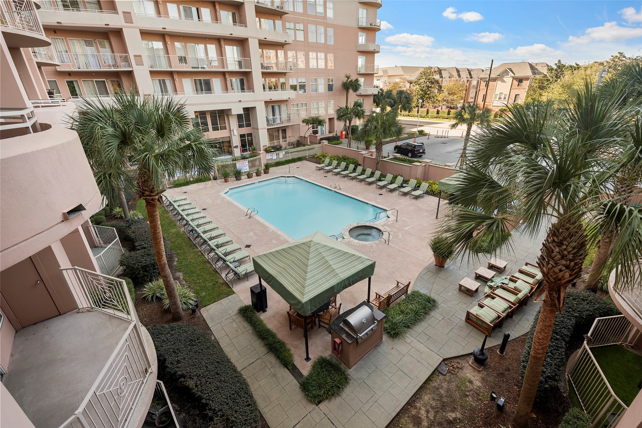 3505 Sage Road, Unit 314 Houston, TX 77056 - Photo 20 of 24 a view of a balcony with chairs and a potted plant