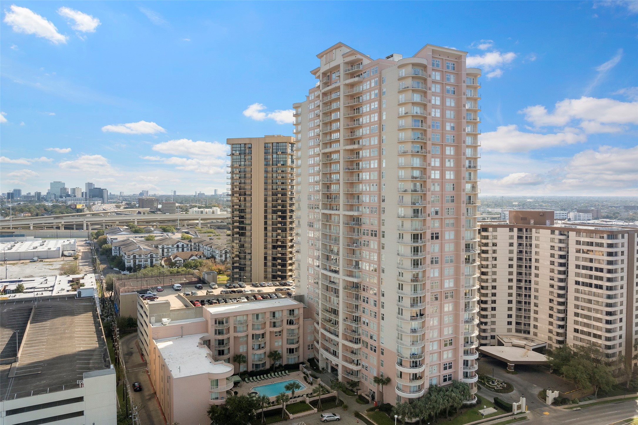 3505 Sage Road, Unit 314 Houston, TX 77056 - Photo 2 of 24 a view of a city with tall buildings