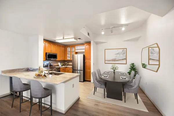 a view of a dining room with furniture and window