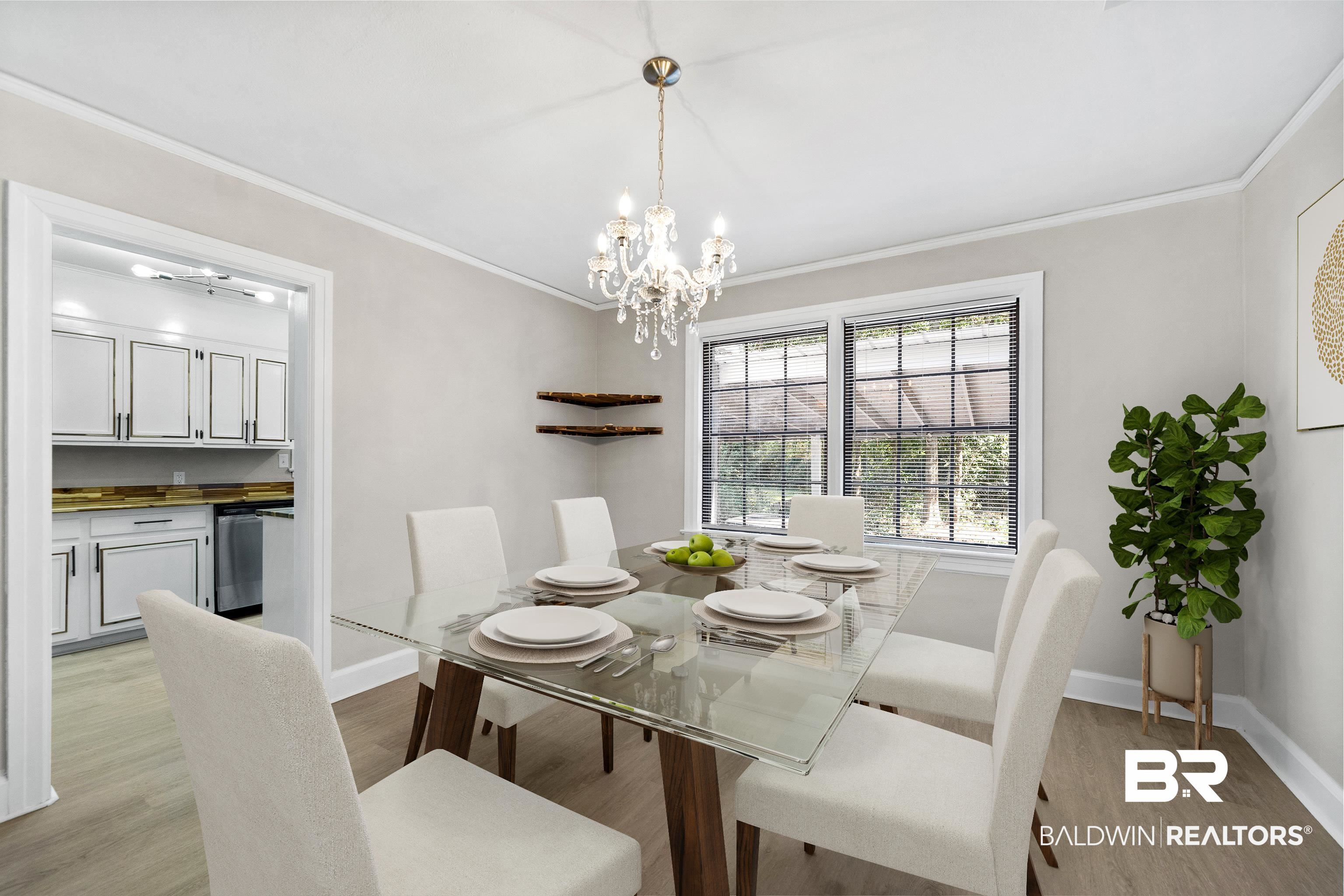 611 Morgan Avenue Mobile, AL 36606 - Photo 10 of 24 Dining area featuring light wood-type flooring, a notable chandelier, and crown molding