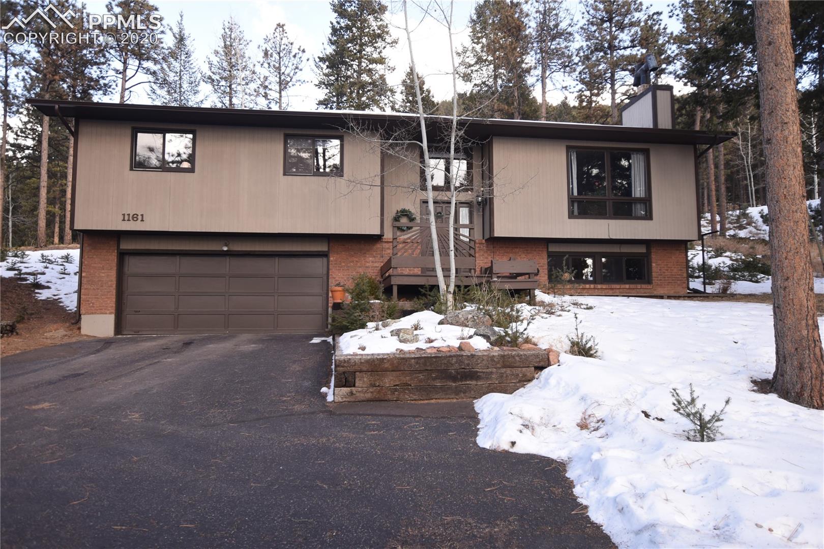 1161 Pine Ridge Road Woodland Park, CO 80863 - Photo 1 of 40 Front of house from Pine Ridge Road.