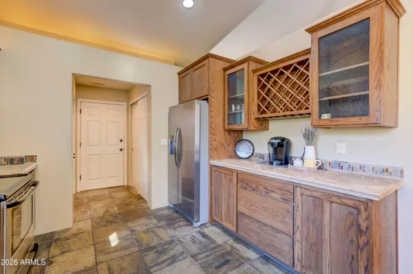 a kitchen with stainless steel appliances granite countertop a sink and stove