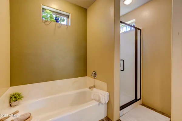 a bathroom with a granite countertop sink toilet a mirror and shower