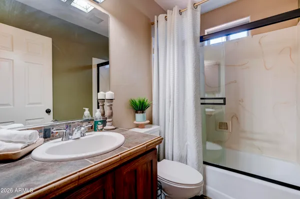 a bedroom with a bed a couch and a couch