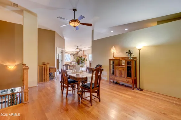 a view of a dining room with furniture and wooden floor