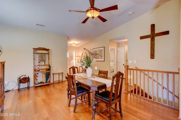 a balcony with wooden floor and outdoor seating