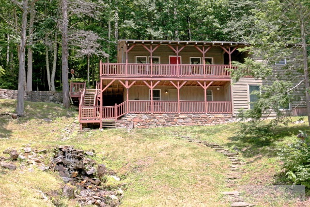 148 Grady Winkler Road Boone, NC 28607 - Photo 14 of 24 a view of a wooden house with a yard