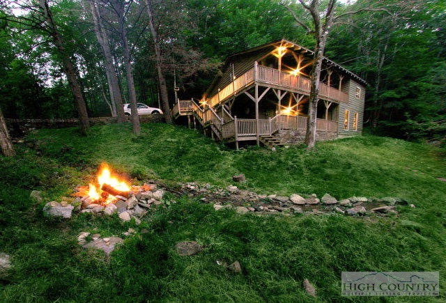 148 Grady Winkler Road Boone, NC 28607 - Photo 18 of 24 a view of a house with backyard and trees
