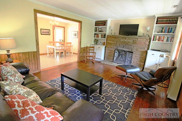148 Grady Winkler Road Boone, NC 28607 - Photo 22 of 24 a living room with furniture and a fireplace