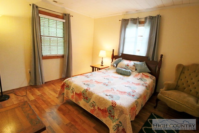 148 Grady Winkler Road Boone, NC 28607 - Photo 4 of 24 a bedroom with a bed and window