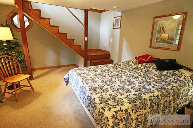 148 Grady Winkler Road Boone, NC 28607 - Photo 10 of 24 a bedroom with a bed and a painting on the wall