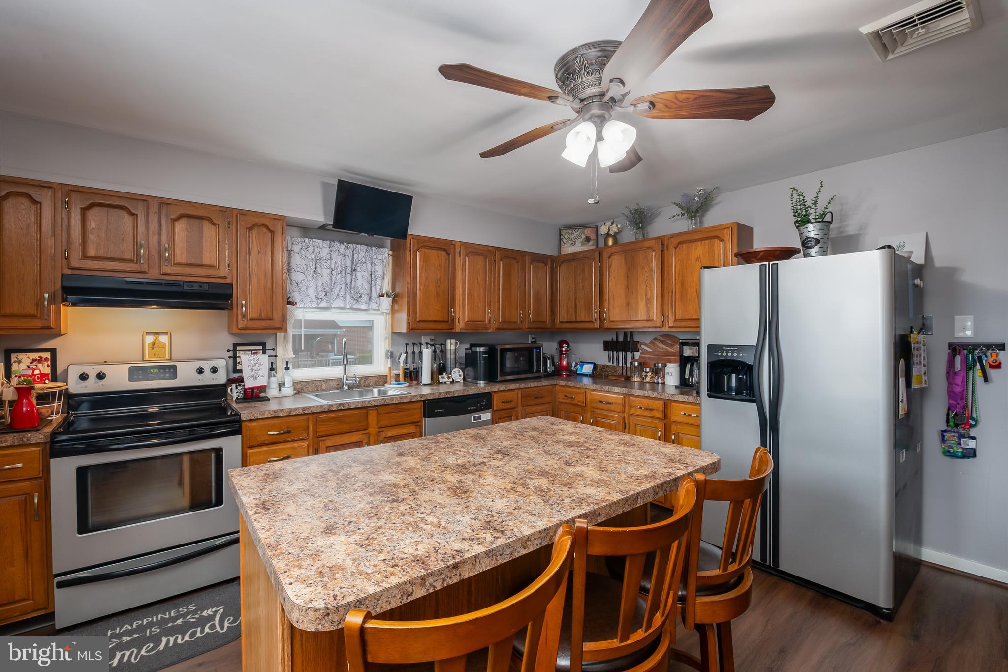 300 Old Fritztown Road Reading, PA 19607 - Photo 14 of 28 a kitchen with stainless steel appliances granite countertop a stove refrigerator and microwave