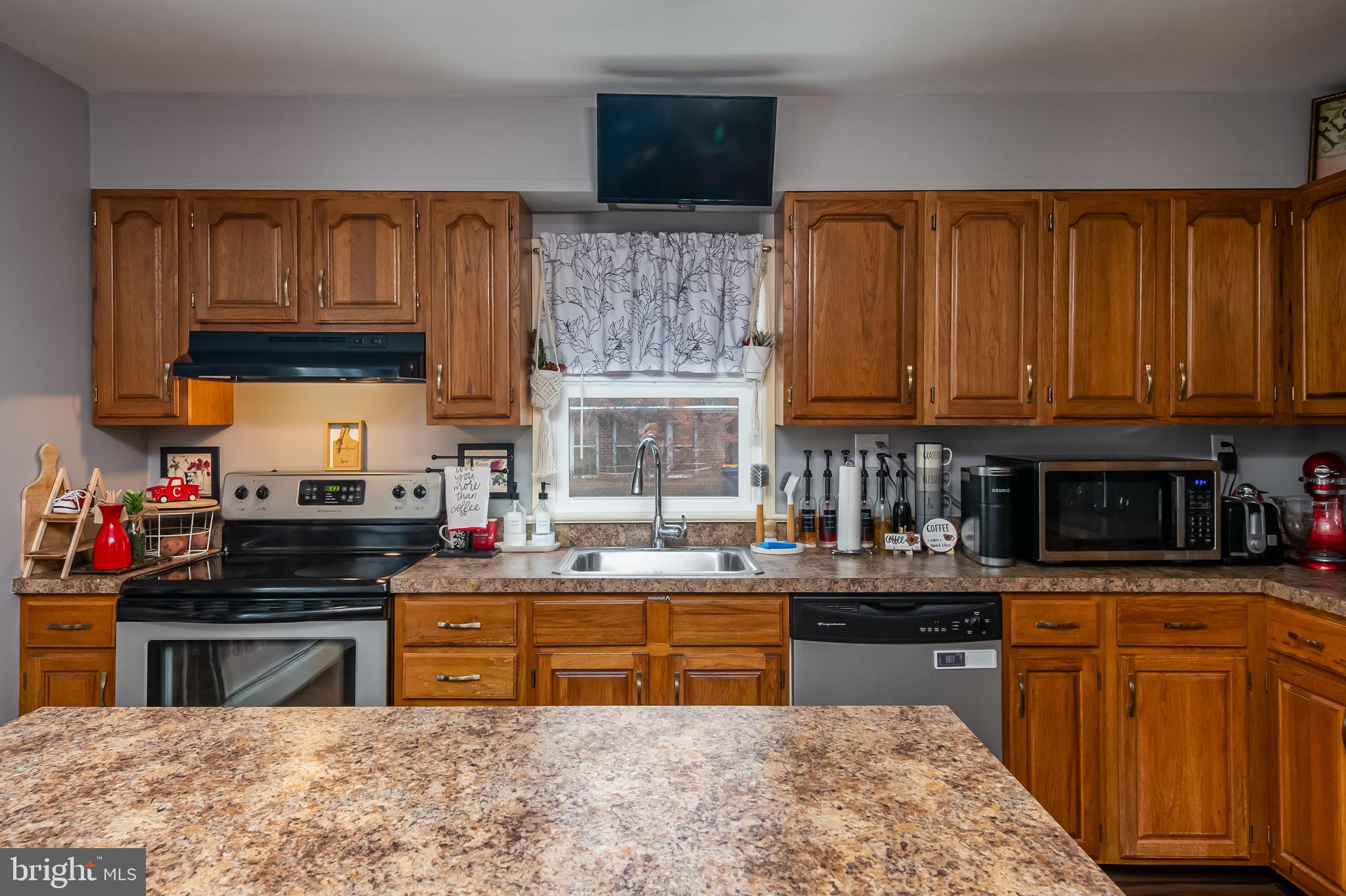300 Old Fritztown Road Reading, PA 19607 - Photo 15 of 28 a kitchen with stainless steel appliances granite countertop a stove sink microwave and cabinets