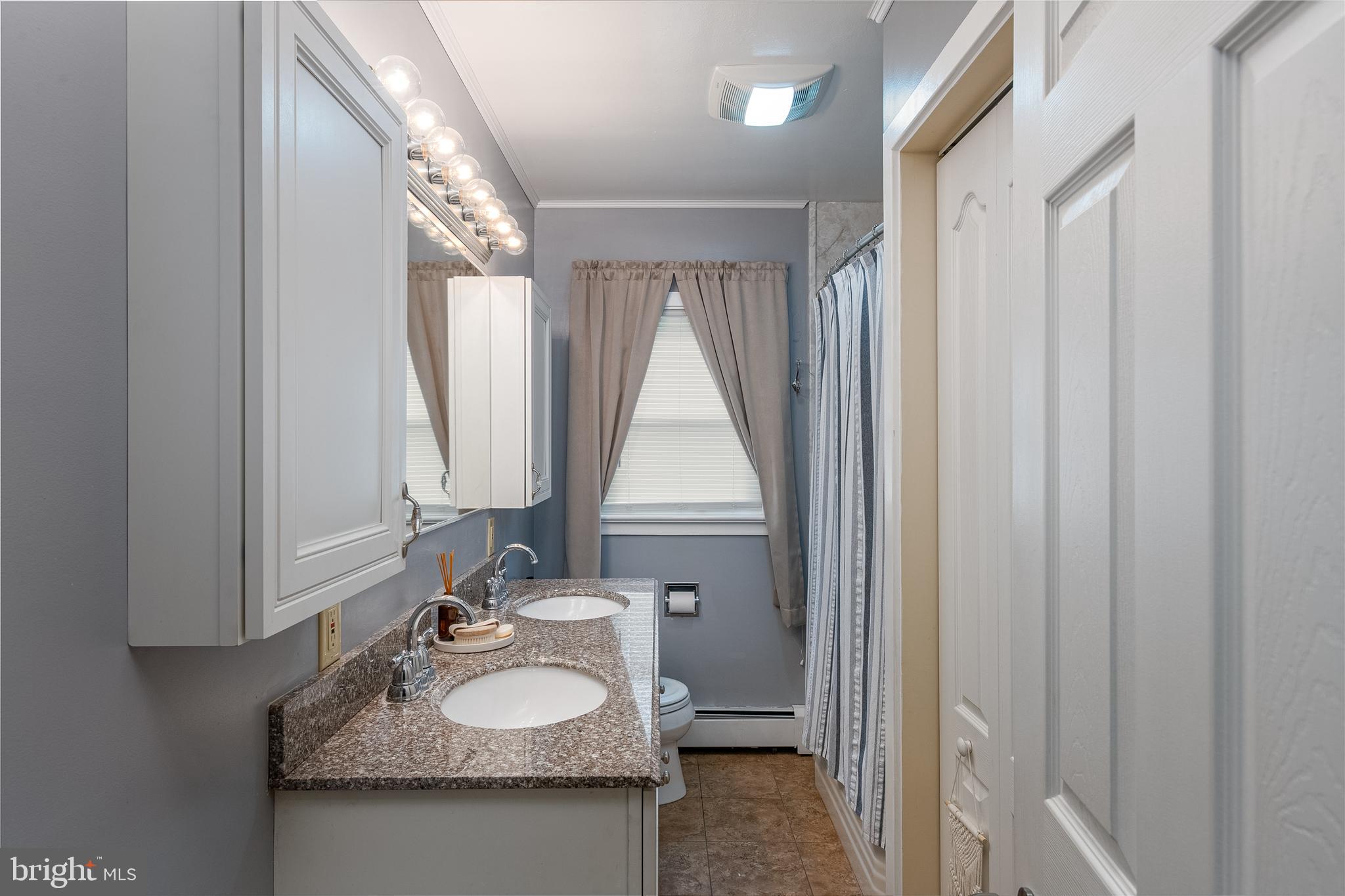 300 Old Fritztown Road Reading, PA 19607 - Photo 20 of 28 a bathroom with a granite countertop sink and a mirror