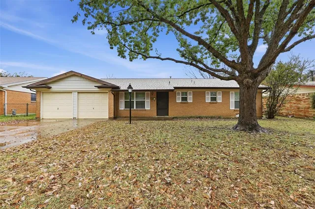 a house with trees in the background