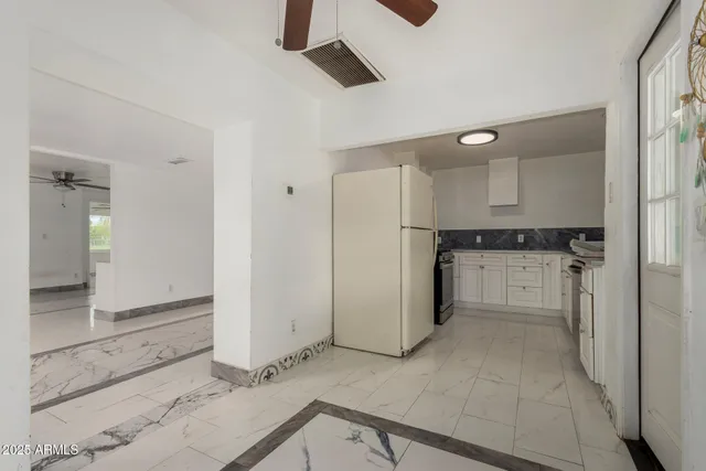 a kitchen with a sink and a stove