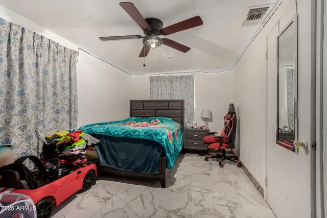 a bathroom with a sink vanity and mirror