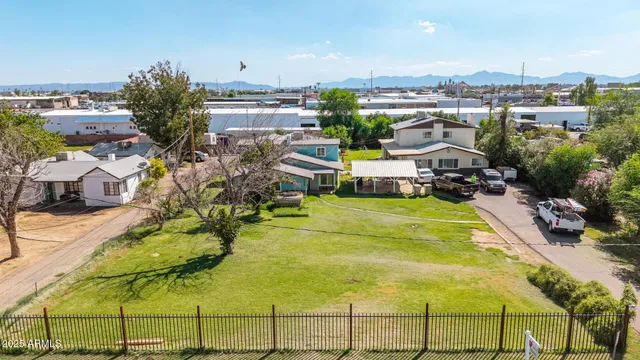 a view of a swimming pool and outdoor seating