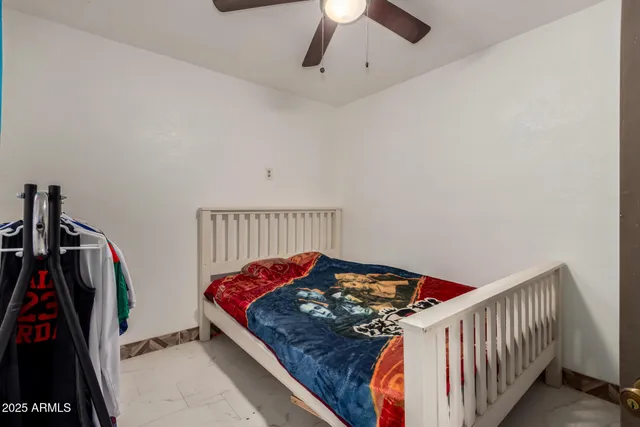 a bathroom with a toilet and a shower curtain