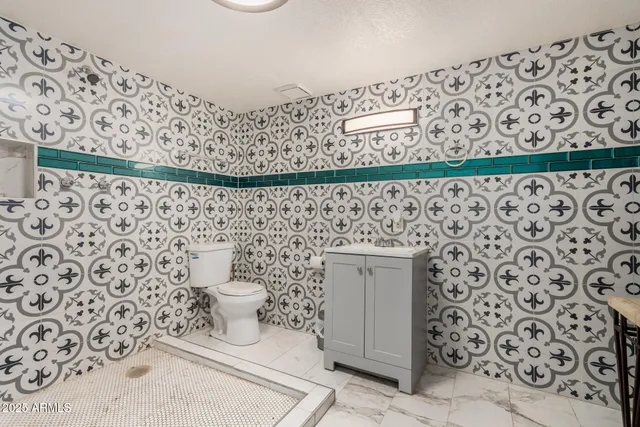 a view of a hallway with wooden floors