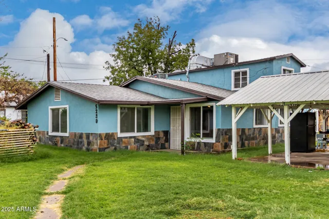 front view of a house with a yard