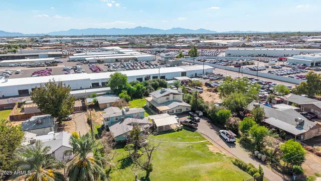 an aerial view of a house with yard swimming pool and outdoor seating