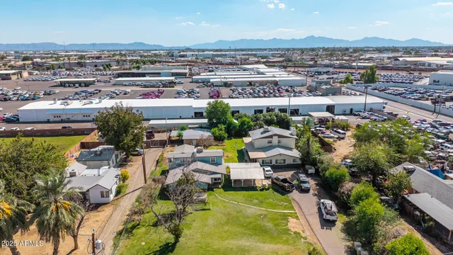 an aerial view of residential house with outdoor space and swimming pool