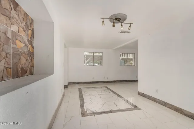 a view of a livingroom with wooden floor