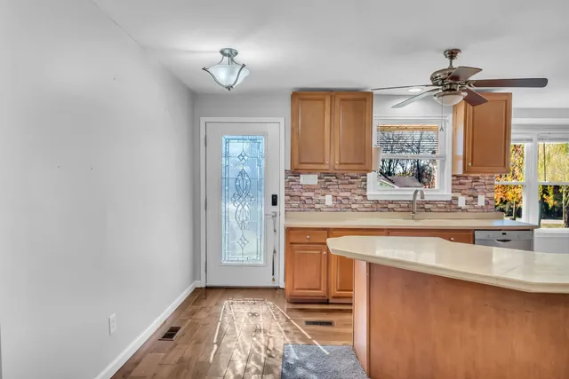a kitchen with a sink and a refrigerator