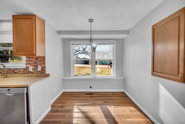 a view of a kitchen cabinets a sink and a window