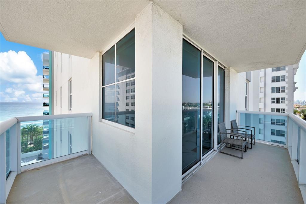 9201 Collins Avenue, Unit 821 Surfside, FL 33154 - Photo 17 of 60 a view of hallway with furniture and windows