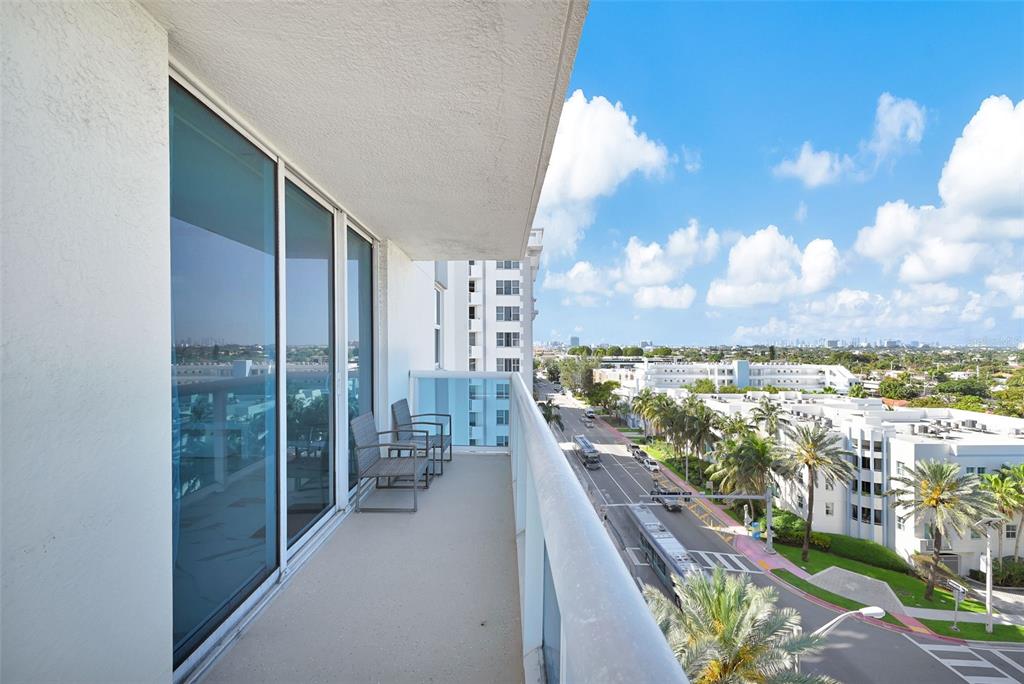 9201 Collins Avenue, Unit 821 Surfside, FL 33154 - Photo 18 of 60 a view of balcony with yard and mountain view in back