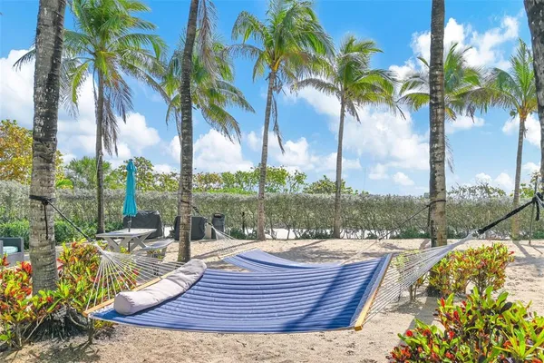 a bathroom with a shower and a glass door