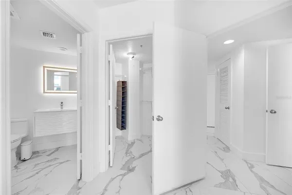 a bathroom with a toilet sink and shower