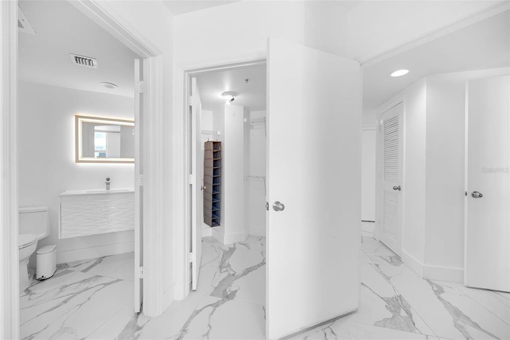 9201 Collins Avenue, Unit 821 Surfside, FL 33154 - Photo 36 of 60 a bathroom with a shower and a glass door