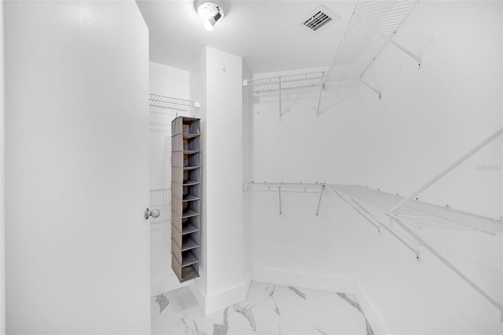 9201 Collins Avenue, Unit 821 Surfside, FL 33154 - Photo 37 of 60 a view of walk in closet with empty racks