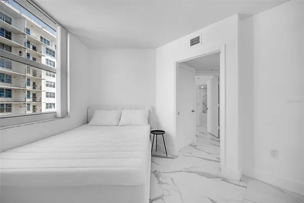 a kitchen with a sink and a mirror