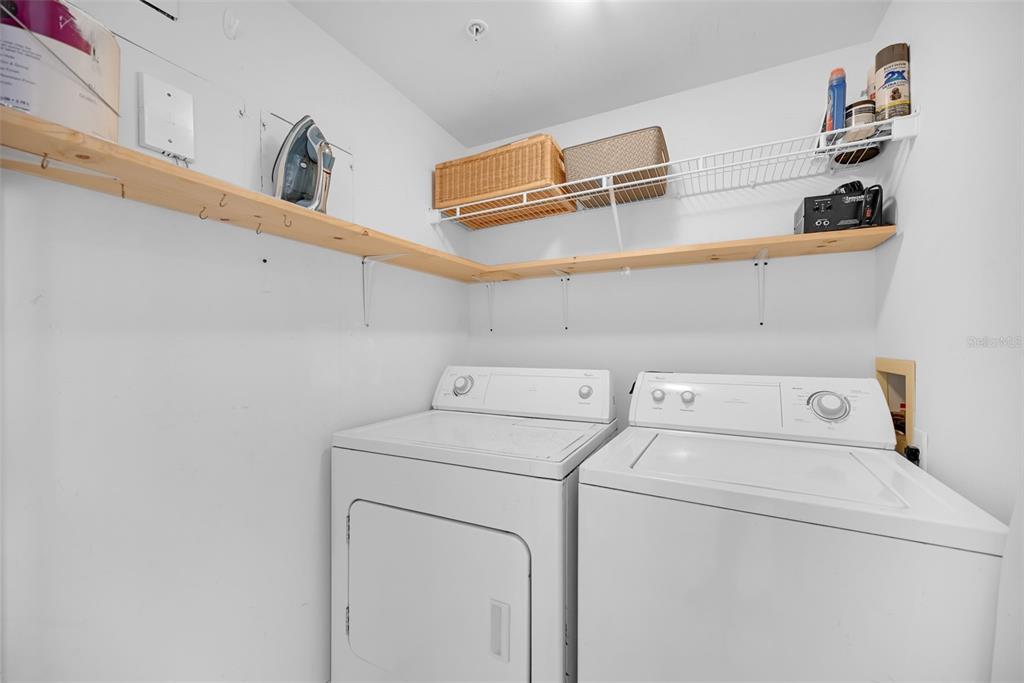 9201 Collins Avenue, Unit 821 Surfside, FL 33154 - Photo 45 of 60 a utility room with dryer and washer