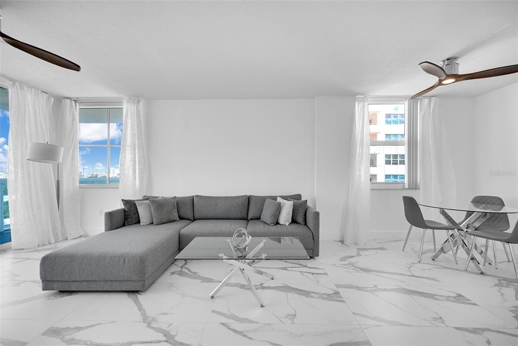 9201 Collins Avenue, Unit 821 Surfside, FL 33154 - Photo 53 of 60 a living room with furniture and a window