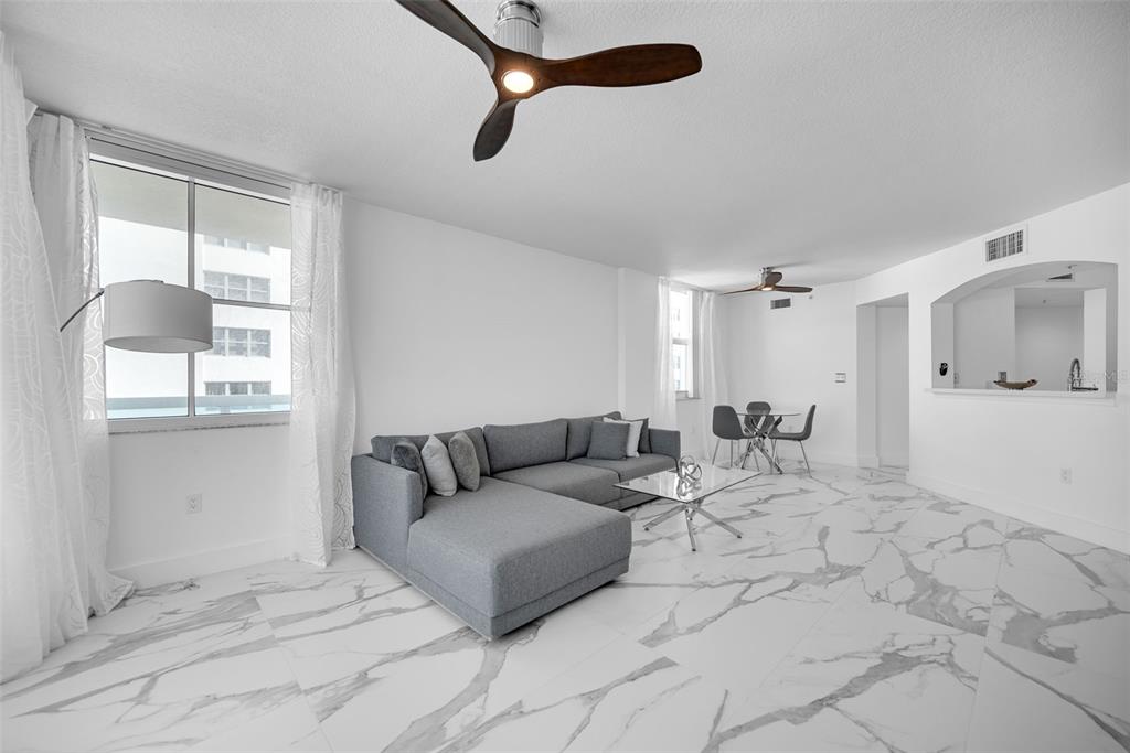 9201 Collins Avenue, Unit 821 Surfside, FL 33154 - Photo 56 of 60 a living room with furniture and a window