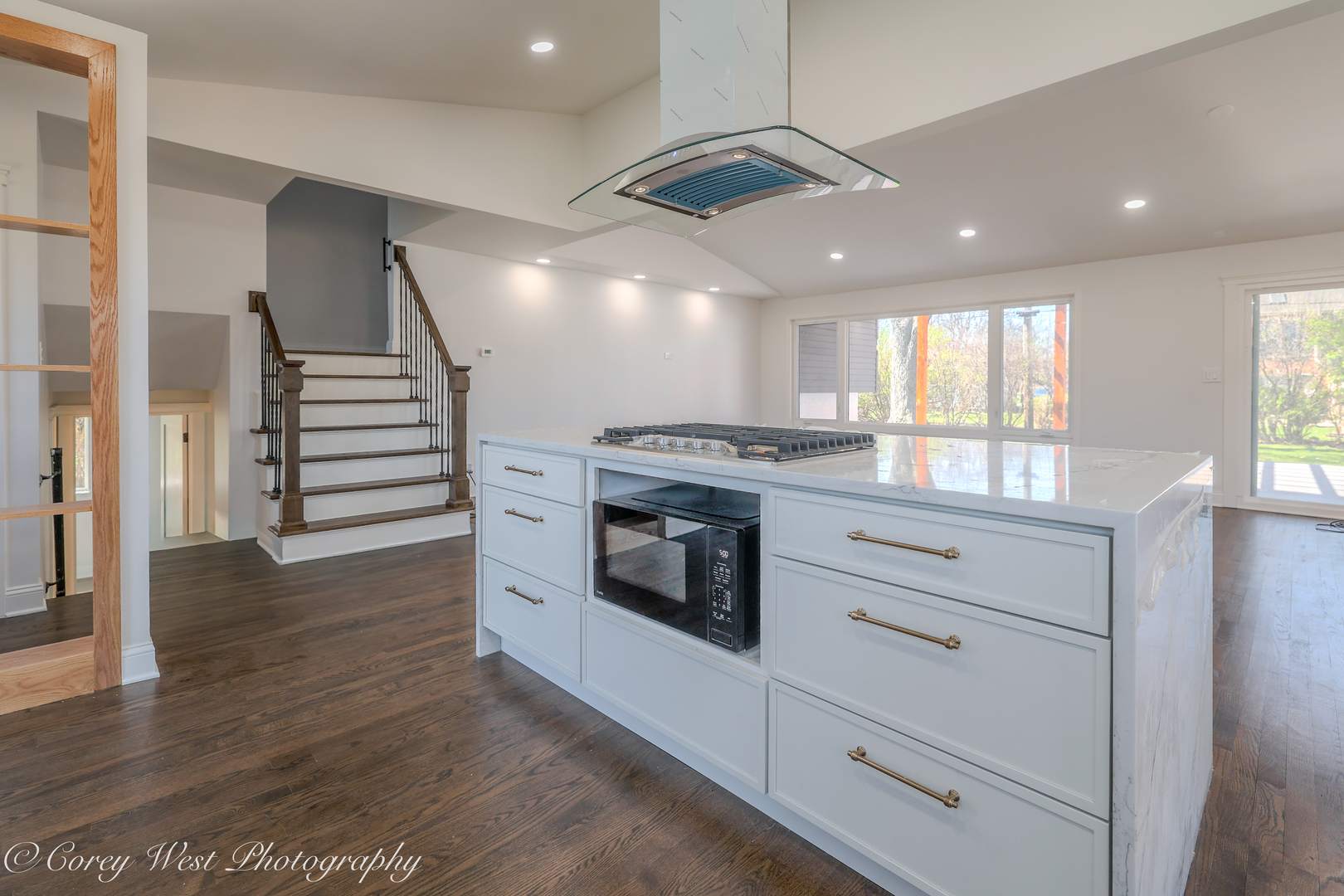 217 Heather Lane Wilmette, IL 60091 - Photo 12 of 44 a kitchen with stainless steel appliances white cabinets and wooden floors