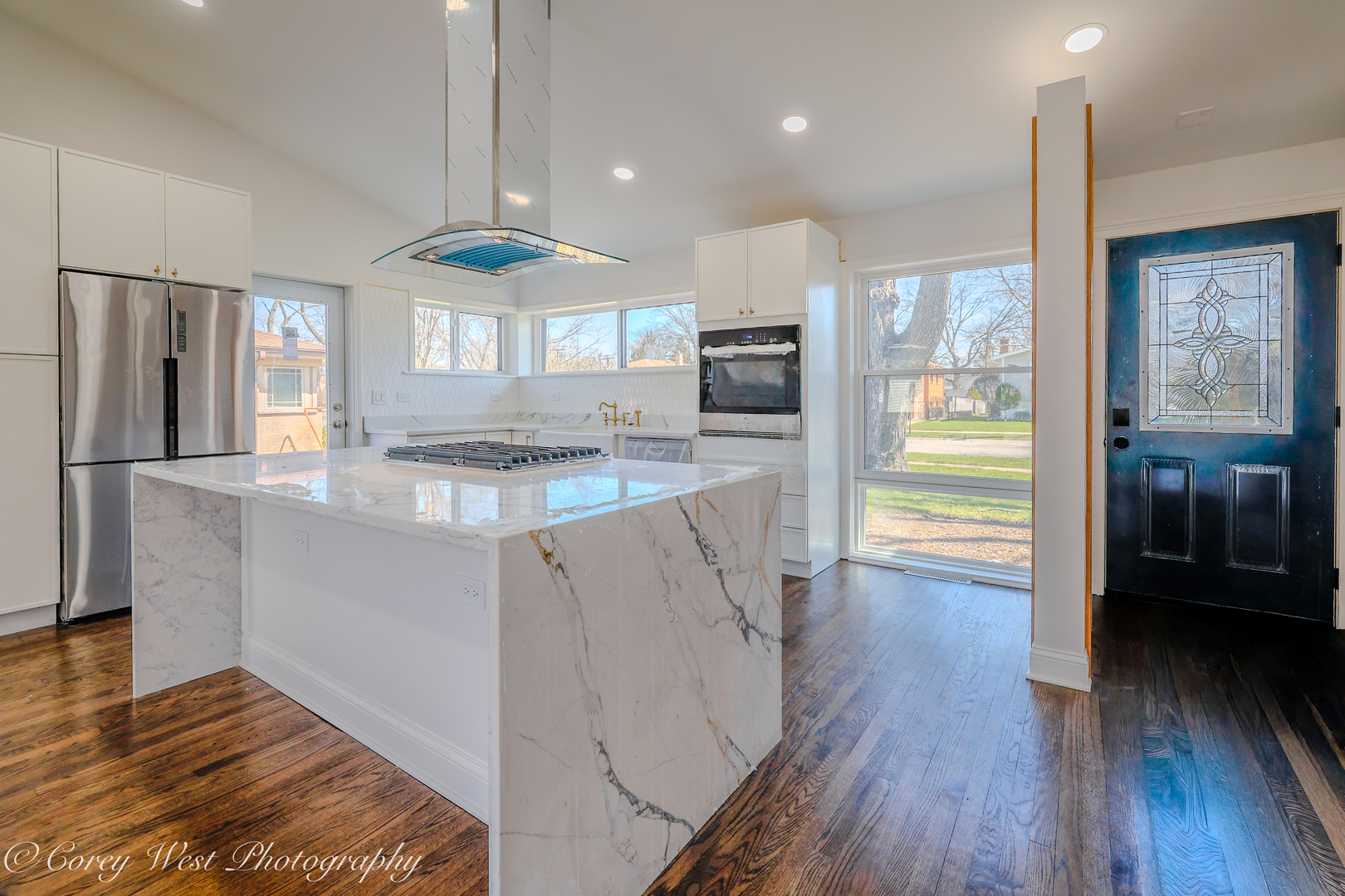 217 Heather Lane Wilmette, IL 60091 - Photo 5 of 44 a kitchen with stainless steel appliances granite countertop a refrigerator a sink dishwasher a stove and white countertops with wooden floor