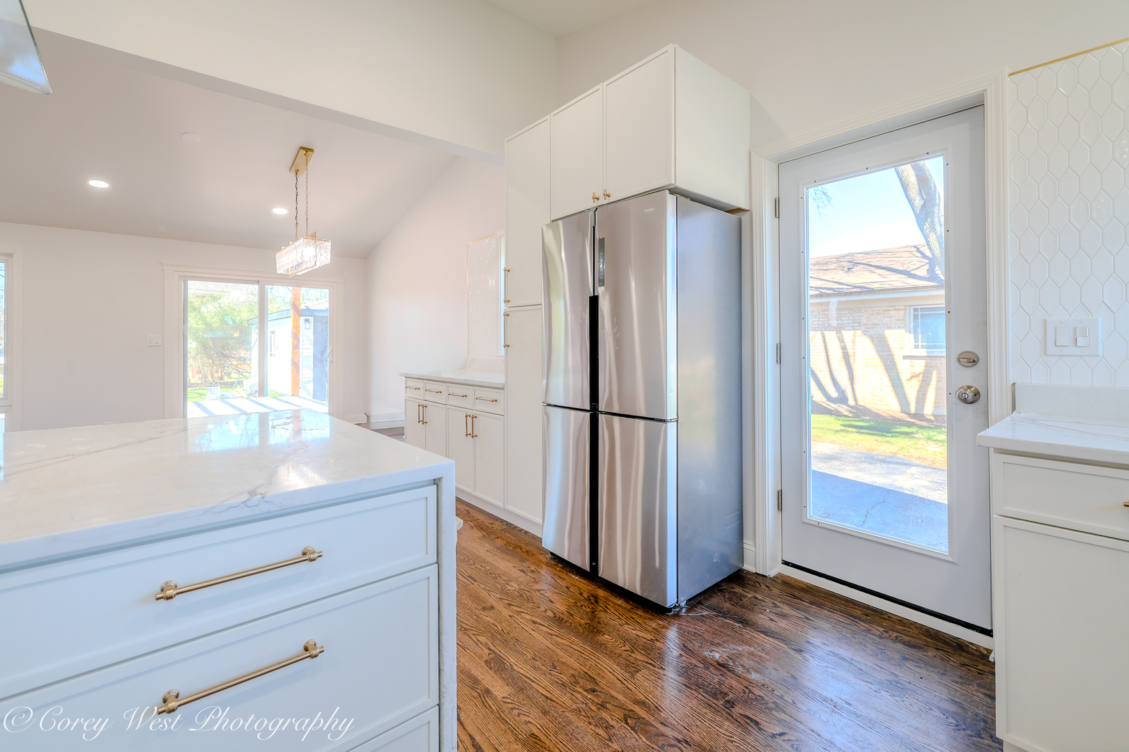217 Heather Lane Wilmette, IL 60091 - Photo 8 of 44 a kitchen with stainless steel appliances granite countertop cabinets wooden floor and a window