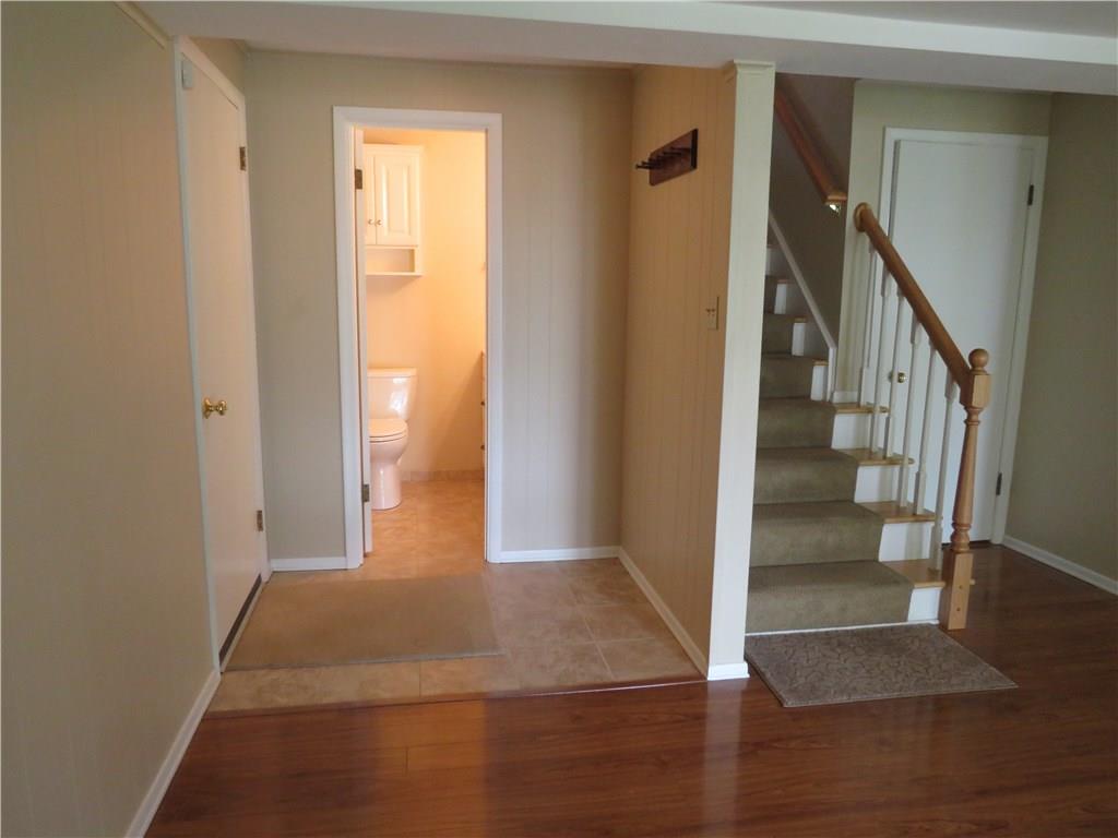 8341 Post Road Allison Park, PA 15101 - Photo 23 of 24 View of the powder room on the lower level. Access the garage from the door on the left. Hang your coat, add a bench, and you have the perfect mud area.