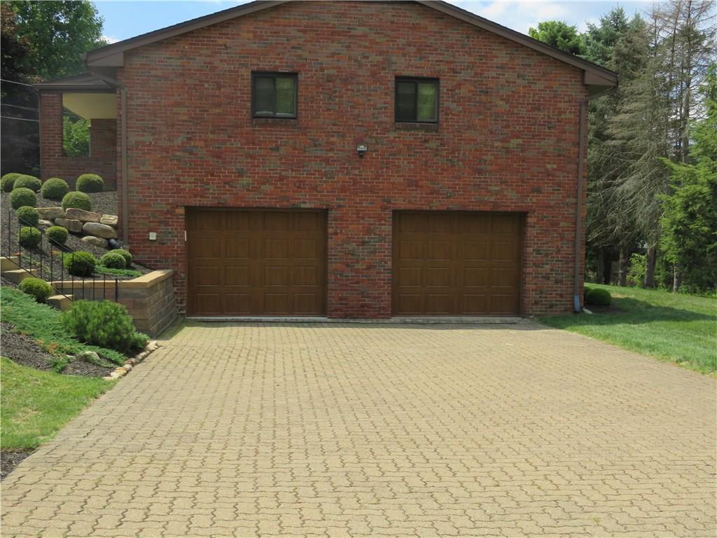 8341 Post Road Allison Park, PA 15101 - Photo 24 of 24 Fantastic view of the omni stone driveway and the attractive garage doors.