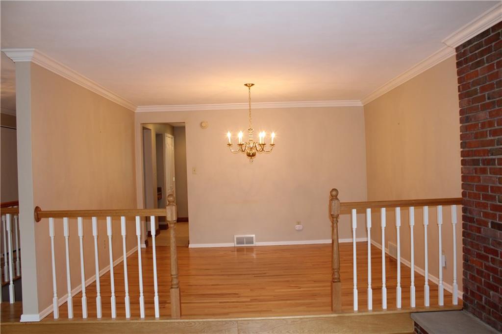 8341 Post Road Allison Park, PA 15101 - Photo 9 of 24 Open dining room to the living room. Look at those floors!