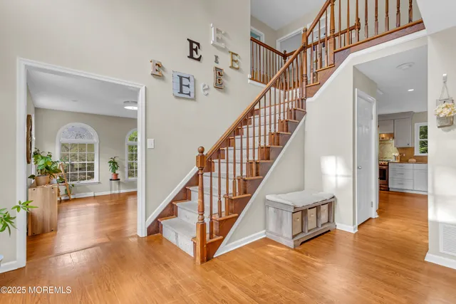 a living room with furniture fireplace and window