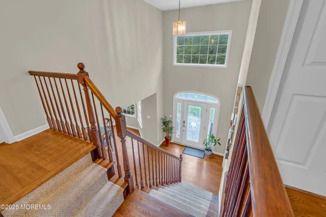 a living room with furniture a rug and a large window