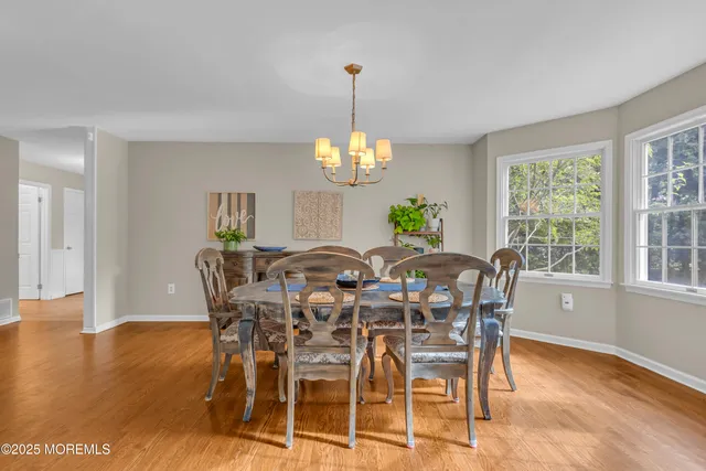 a living room with furniture fireplace and window