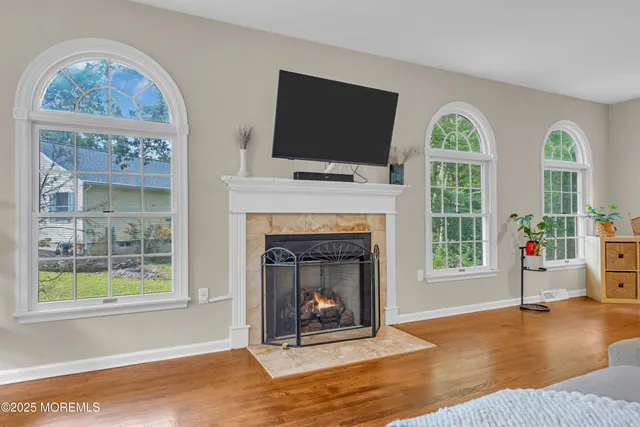 a bed room with a bed and a chair